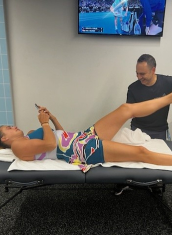 Associate Professor Amir Takla treats women’s singles world number one tennis player Aryna Sabalenka.